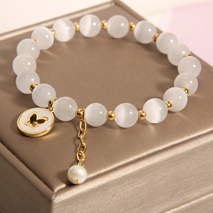 Bracelet d'amour avec breloque papillon œil de chat et Buddha Stones