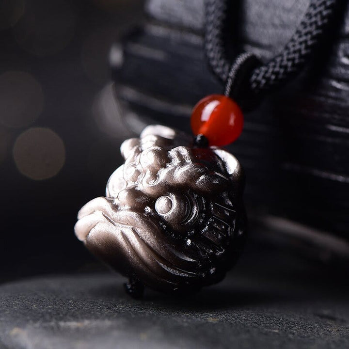Buddha Stones en obsidienne naturelle argentée et brillante représentant un lion dansant et une protection