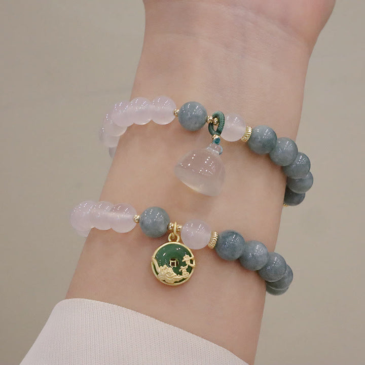 Bracelet de protection avec boucle de paix en Buddha Stones et jade blanc et fleur de lotus