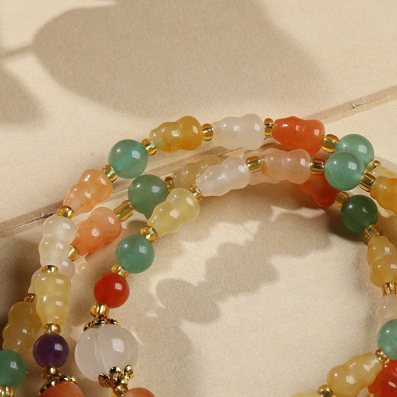 Bracelet de richesse en jade et soie dorée avec Buddha Stones