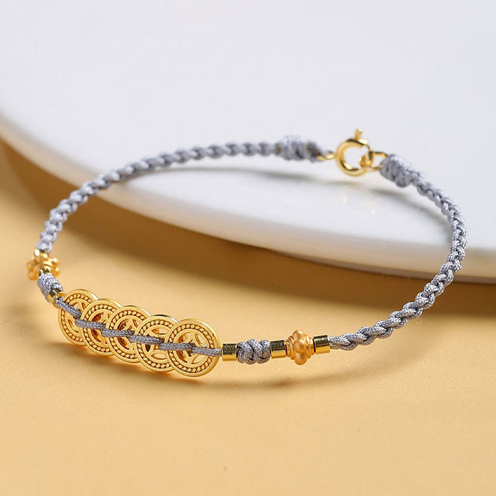 Bracelet tressé en corde bleue avec perles et arbre de fortune en cuivre et Buddha Stones