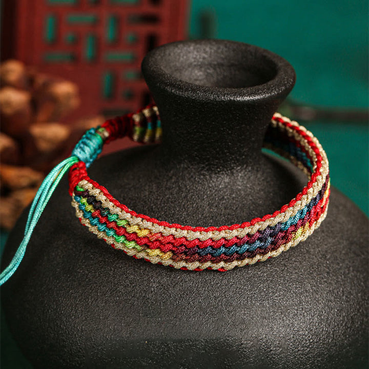 Bracelet tressé de protection multicolore arc-en-ciel fait main en Buddha Stones tibétaines