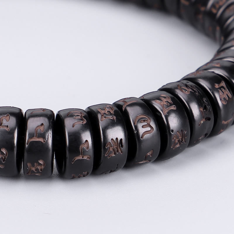 Bracelet en corde Buddha Stones perles de noix de coco tibétaines gravées avec le mantra positif Om Mani Padme Hum