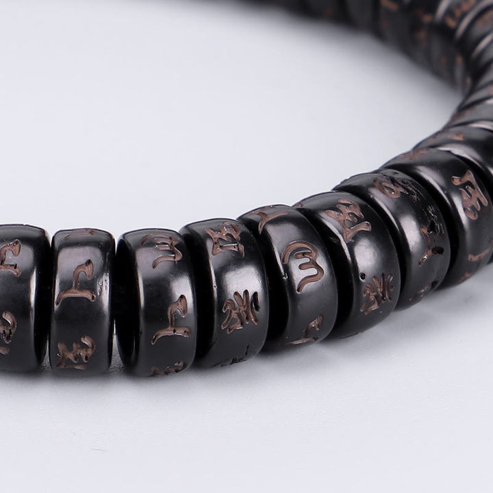 Bracelet en corde Buddha Stones perles de noix de coco tibétaines gravées avec le mantra positif Om Mani Padme Hum