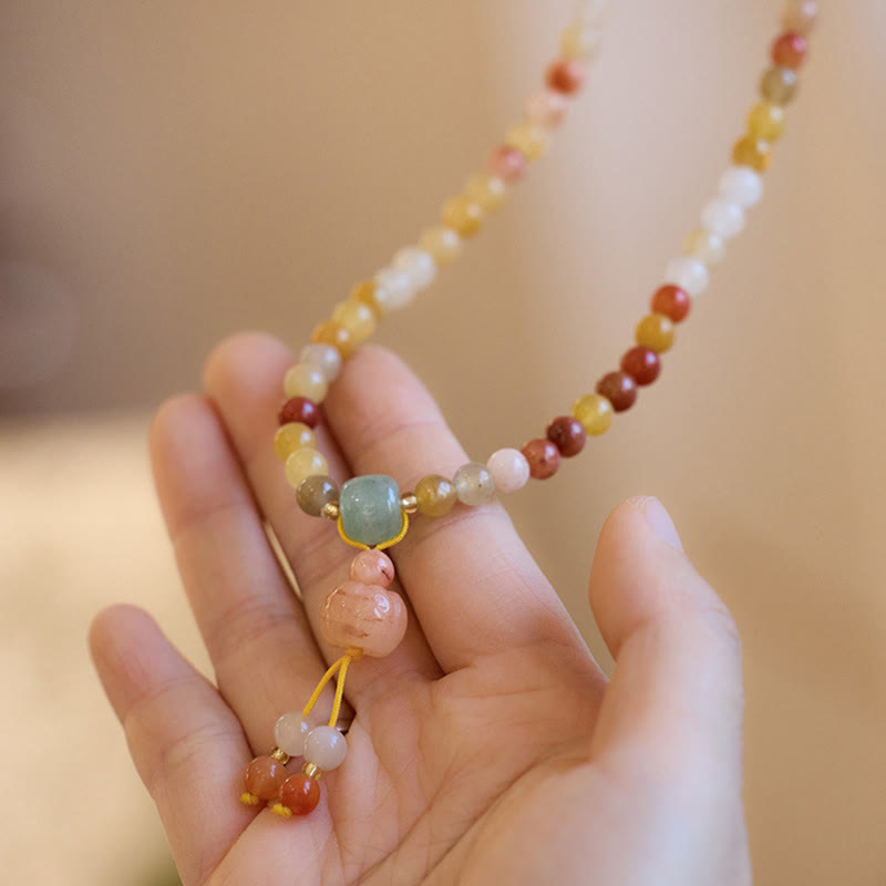 Bracelet triple tour en jade doré et soie naturelle avec breloque citrouille et Buddha Stones