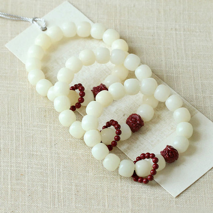 Buddha Stones de Bodhi Naturelles Cinabre Lion Dansant Charme Sagesse Harmonie Poignet Mala